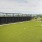 a fenced in lawn next to a building