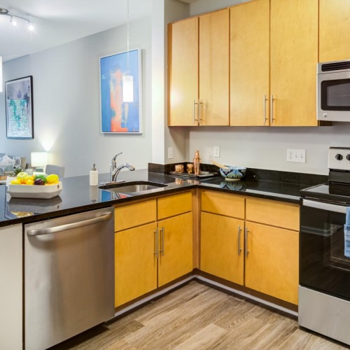 Settle into comfort at Union Heights a kitchen with wooden cabinets