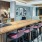 a kitchen with a bar and chairs
