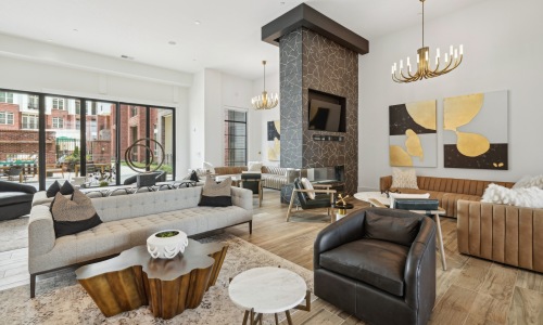 a clubroom with couches, tables and chairs