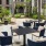 a patio with chairs and tables