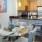 a kitchen with a table and chairs