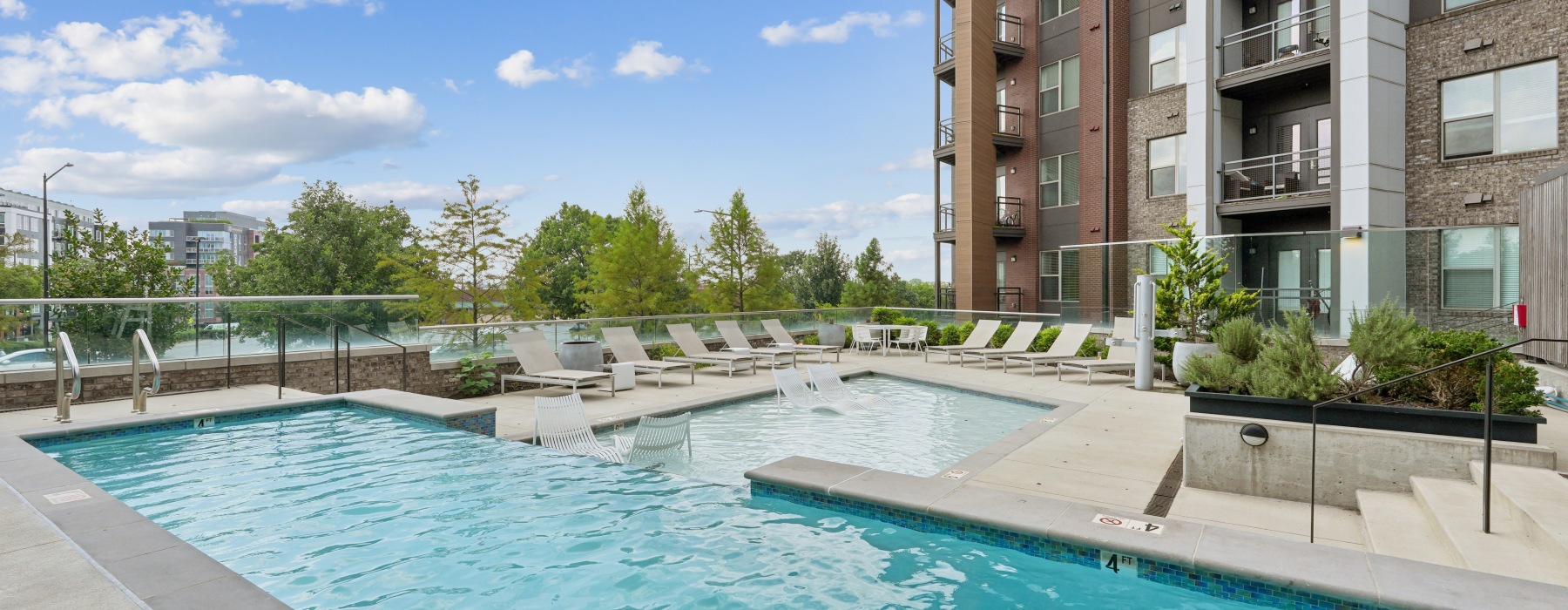 Resort-Style Pool Deck with extensive pool chairs