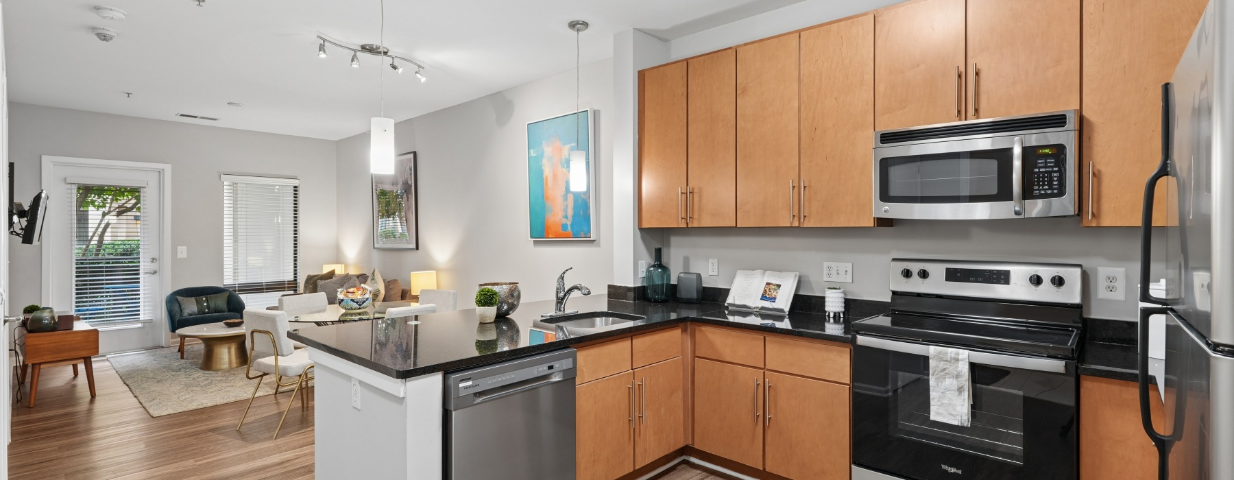 Kitchen with stainless steel appliances and bar seating