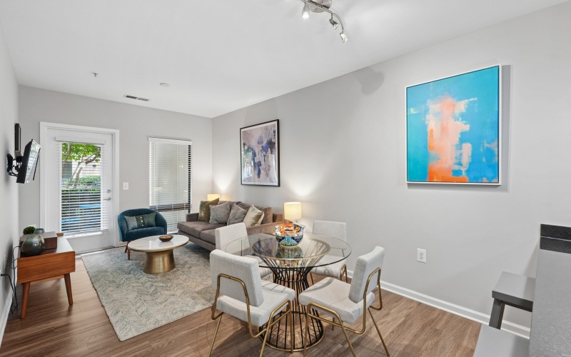 Living and dining area with dining table and living room couch